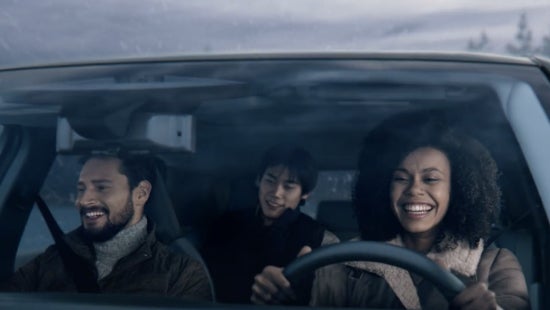 Three passengers riding in a vehicle and smiling | Andy Mohr Nissan in Indianapolis IN