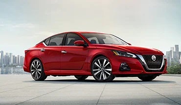 2023 Nissan Altima in red with city in background illustrating last year's 2022 model in Andy Mohr Nissan in Indianapolis IN